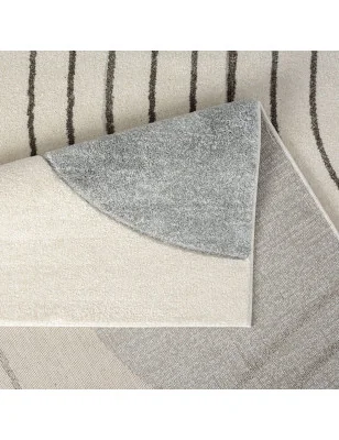 Szary dywan Bonny 71700 z precyzyjnie wyciętym wzorem przestrzennym.