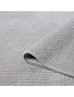 Detal krawędzi i splotu dywanu high-low w odcieniu szarości